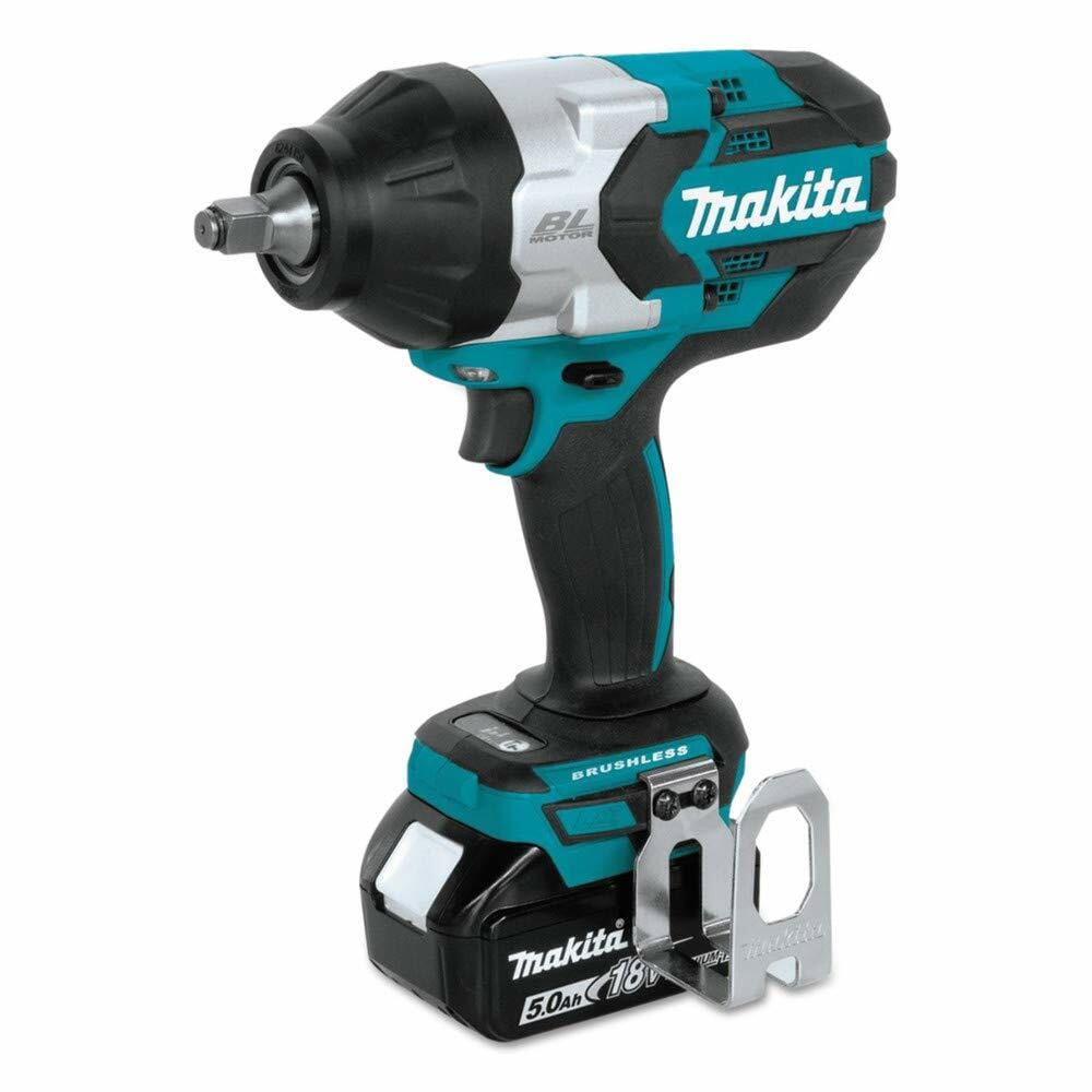 A studio image of the Makita XWT08T 18V LXT impact wrench with a 5.0Ah battery and the metal tool hook attached, viewed from a three-quarter angle.