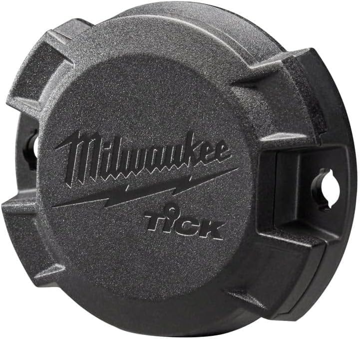 Angled studio shot of the black Milwaukee TICK tool tracker displaying its rugged housing and integrated mounting flanges.