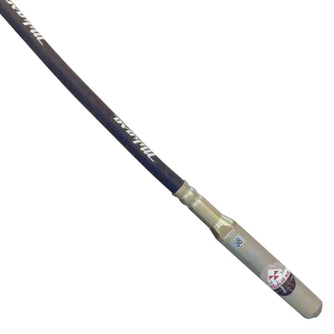 Close-up view of the black flexible shaft connecting to the silver metal vibrating head.