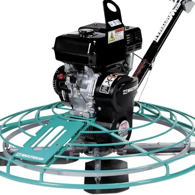 Close-up of the Multiquip power trowel base showing the 8.5 HP Honda GX270 engine, center lifting bale, and front maintenance access door.