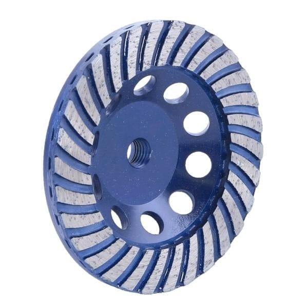 A perspective view of the OX Tools OX-UCGT-4 Ultimate 4-inch turbo diamond cup wheel featuring a blue steel body with an M14 threaded hub and wide turbo segmented diamond rim designed for aggressive coarse grit grinding of concrete and natural stone.