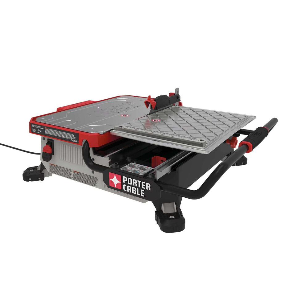 Front view of the Porter-Cable PCE980 7-inch wet tile saw showing the stainless steel fixed deck, water reservoir, and protective roll cage for professional remodeling.