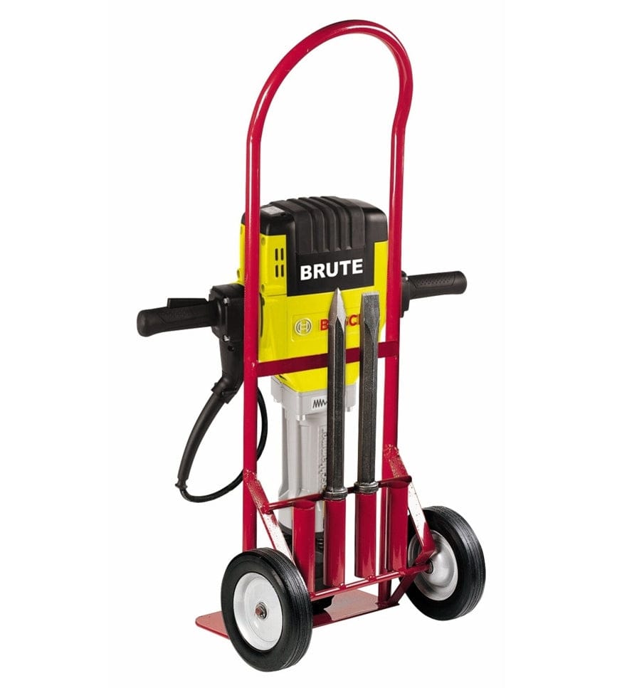 Bosch Brute jackhammer mounted on red hand truck with power cord and three chisel bits secured at the base for transport.