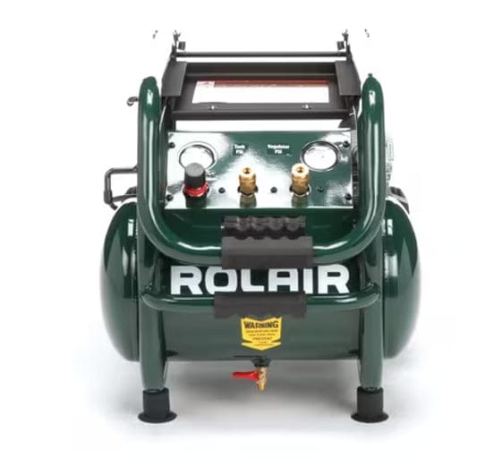 Close-up view of the compressor's control panel, showing the tank pressure gauge, regulator gauge, dual quick-disconnect air couplers, and the tank drain valve