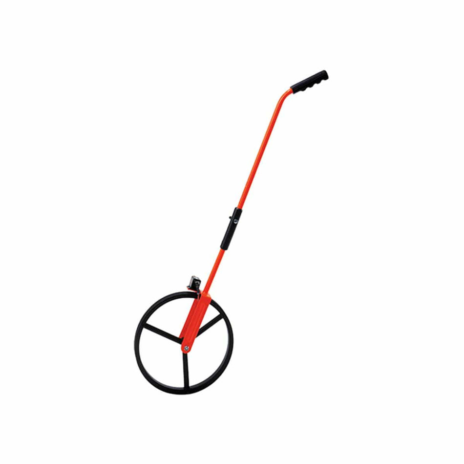 This is an eye-level, full-shot of a bright orange measuring wheel, standing upright and angled slightly to the right against a plain white background. The device consists of a large, black, spoked wheel at the bottom connected by a long, slender orange handle that extends upwards to a black handgrip, with a smaller black mechanism visible near where the handle connects to the wheel.