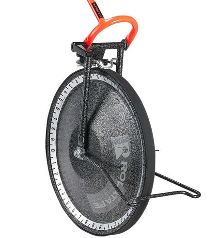 Rolatape measuring wheel with solid disk design, upright stand, and labeled edge for distance tracking on uneven terrain.