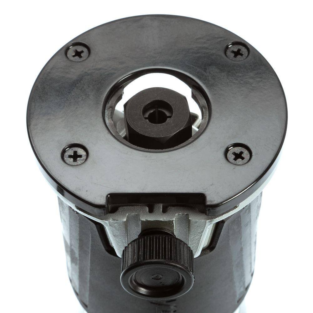Underside view of the Makita RT0701C fixed base router showing the non-marring base insert designed to protect workpieces and the precise 1/4 inch collet for router bits.