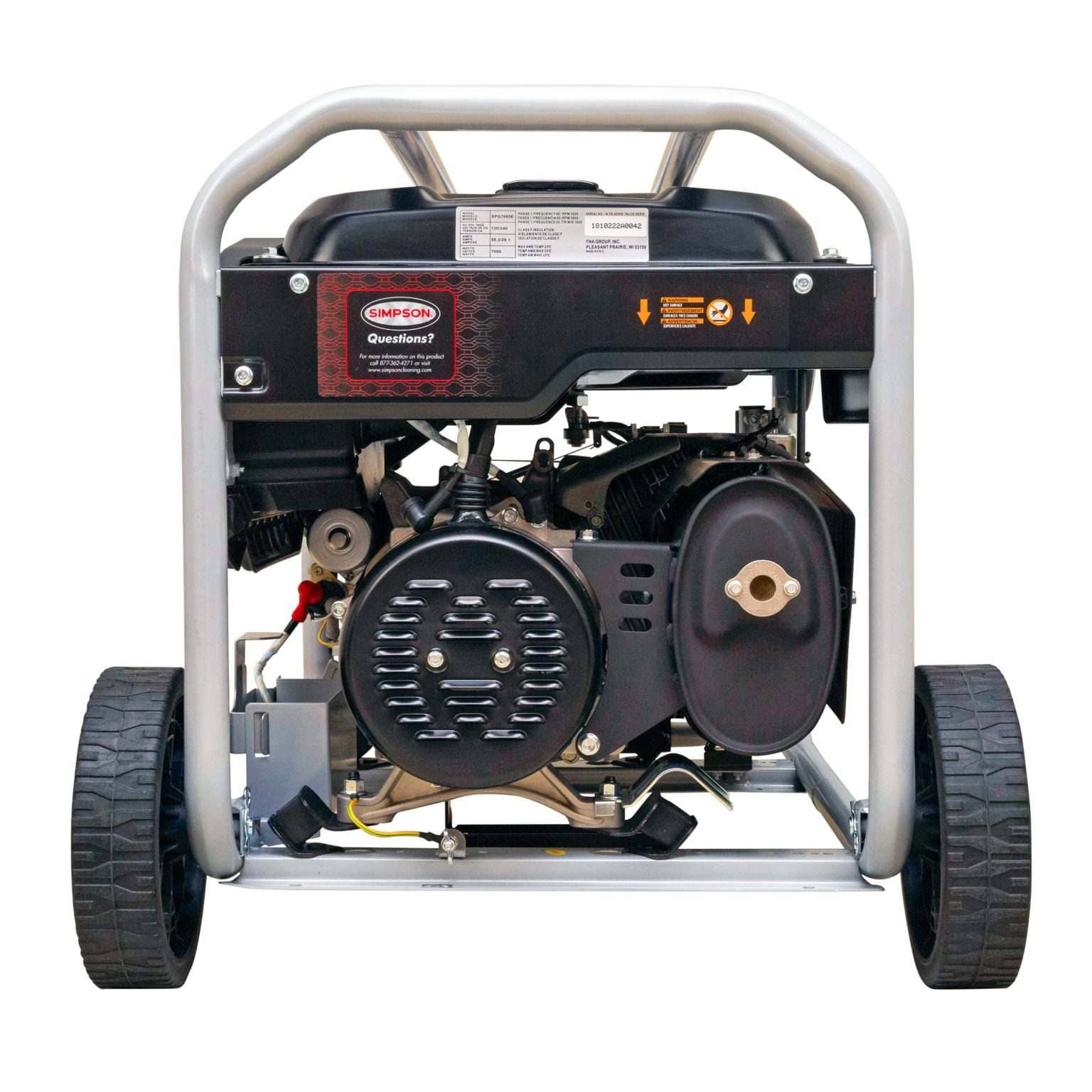 Rear view of the generator showing the silver alternator end cap, black muffler assembly with heat shield, and the wheel axle.