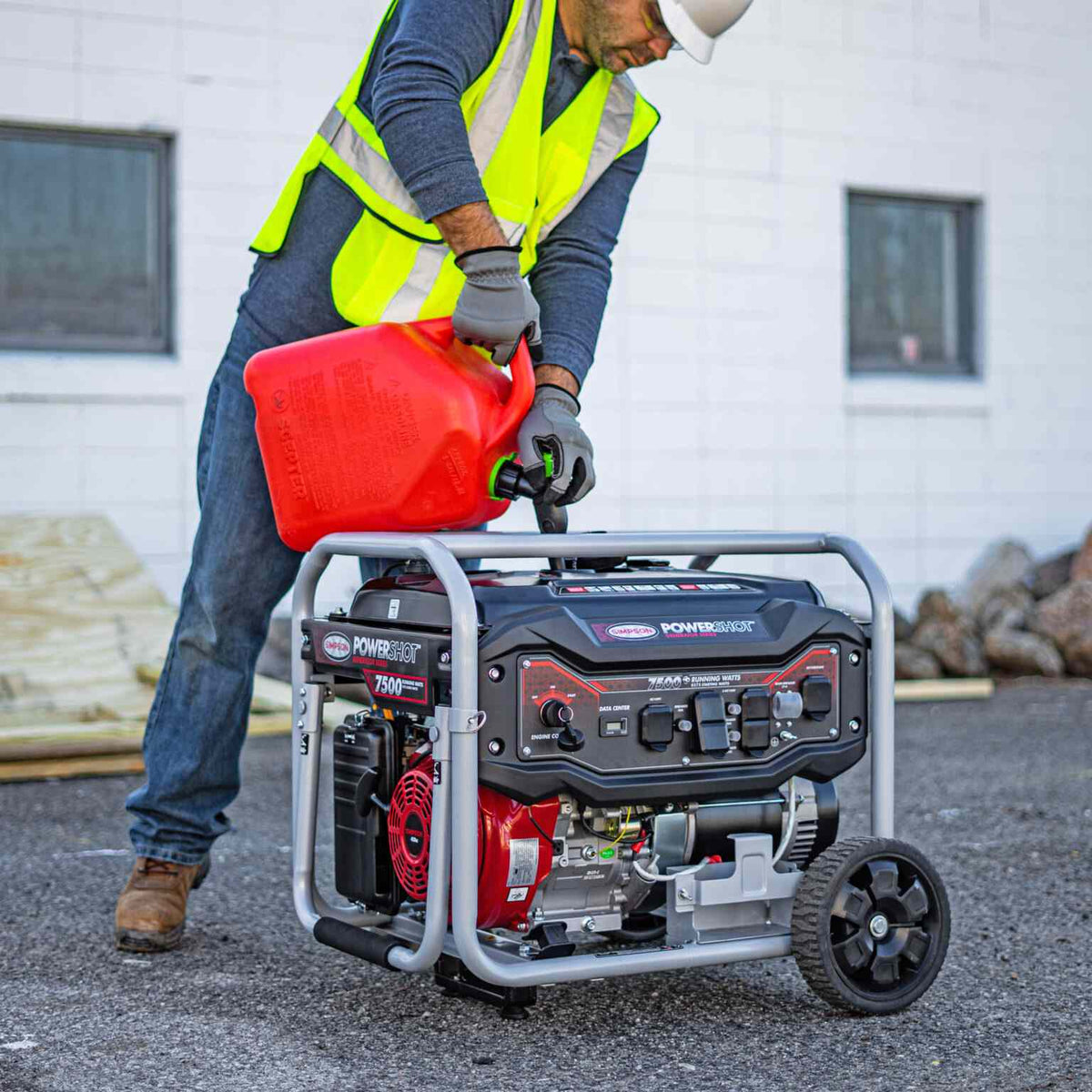 Lifestyle image of a worker wearing a safety vest pouring fuel from a red gas can into the top of the Simpson portable generator.
