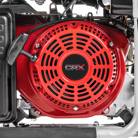 Close up view of the red recoil starter assembly on the CRX engine with the black pull handle and cooling vents.