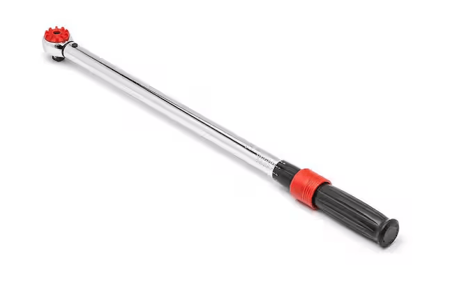 A long torque wrench is displayed diagonally against a plain white background. The tool has an extended, polished chrome shaft with a compact ratcheting head at one end, featuring a bright red circular control. At the opposite end is a long, ribbed black handle for a secure grip, accented by a red adjustment collar near the base of the metal shaft. The overall design is slim and professional, with a chrome, black, and red color scheme.