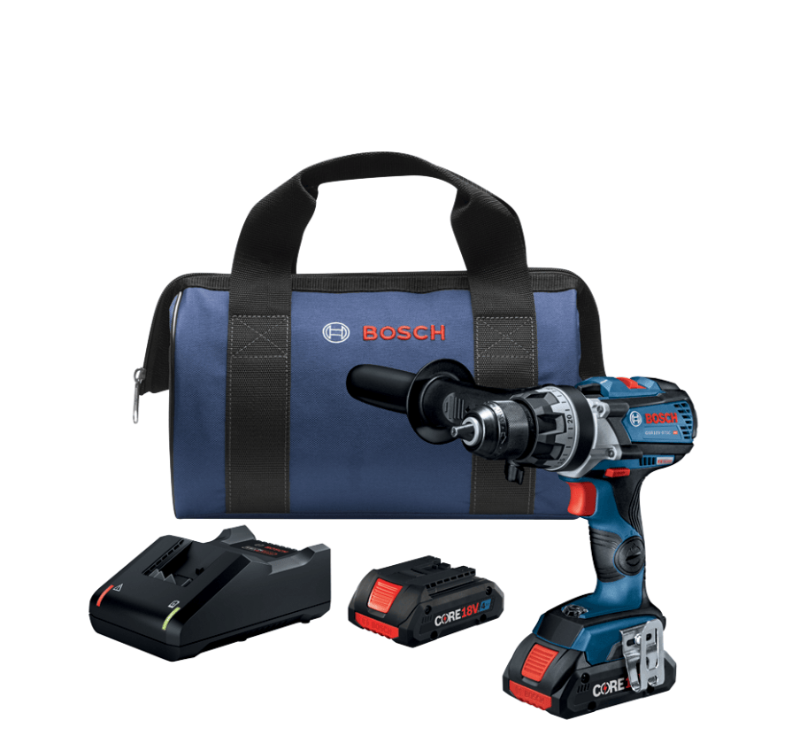 This studio product photograph showcases a Bosch 18V cordless heavy-duty drill/driver kit neatly arranged on a clean white background. Positioned upright on the right is the drill equipped with an auxiliary side handle and attached CORE18V battery pack, accompanied to the left by a spare CORE18V battery, a desktop fast charger, and a matching Bosch zippered contractor tool bag in the background.