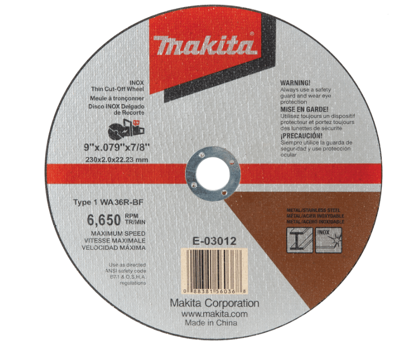 This image shows a close-up product view of a Makita 9-inch INOX thin cut-off wheel (Model E-03012) resting on a white background. The abrasive metal-cutting disc is circular and metallic grey with a red and white Makita logo at the top, a central arbor hole surrounded by a metal reinforcement ring, a barcode at the bottom, and brown and red warning label graphics printed across its surface.