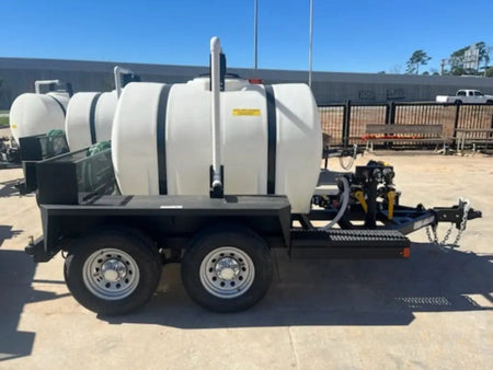 A direct side view of the 525-gallon water transport trailer emphasizing the balanced dual-axle design and the front-mounted engine and pump assembly platform.