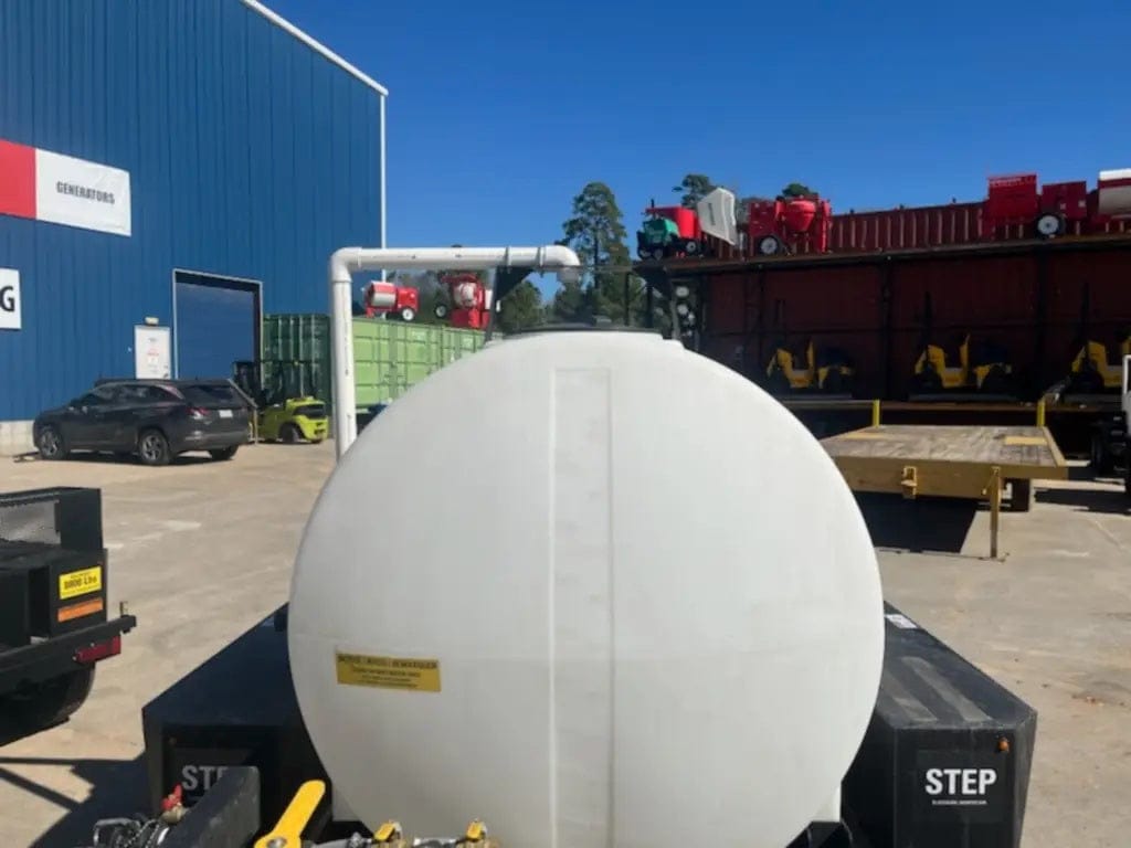 A rear view of the Simpson mobile water tank highlighting the large vertical fill tube and the rugged structural supports that secure the 525-gallon tank to the chassis.