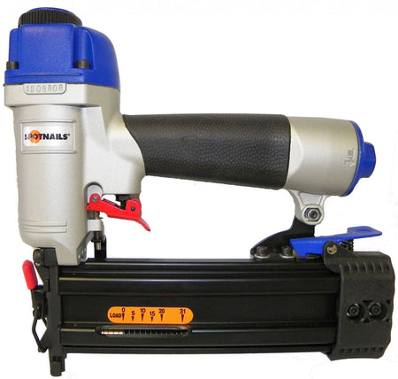 Spotnails CB1850 18 gauge pneumatic brad nailer with a silver magnesium body, blue cylinder cap, and side-load aluminum magazine for professional finish carpentry.