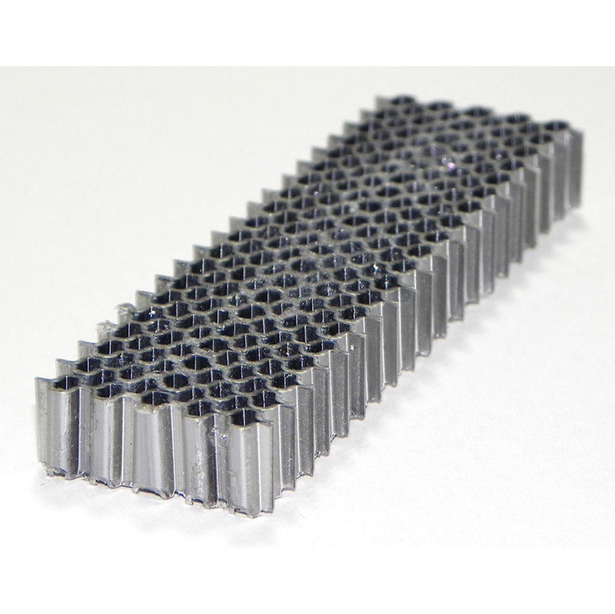 Spotnails 616-5M straight strip of 1-inch wide crown corrugated steel fasteners with 3/8-inch leg lengths for joining wood corner joints.