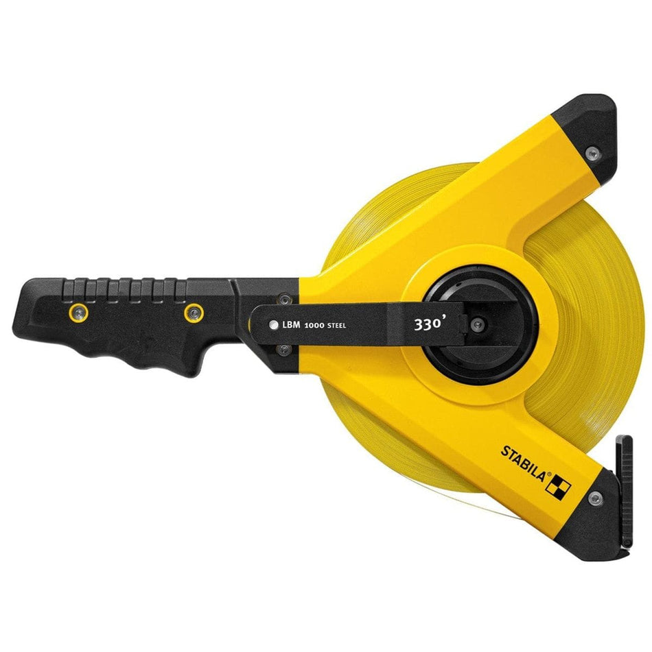 Stabila 30930 LBM 1000 STEEL open reel tape measure shown in a close‑up product view with high‑contrast yellow housing, steel blade reel, ergonomic crank labeled 330 degrees, and durable Y‑frame design engineered for long‑distance measuring on professional jobsites.