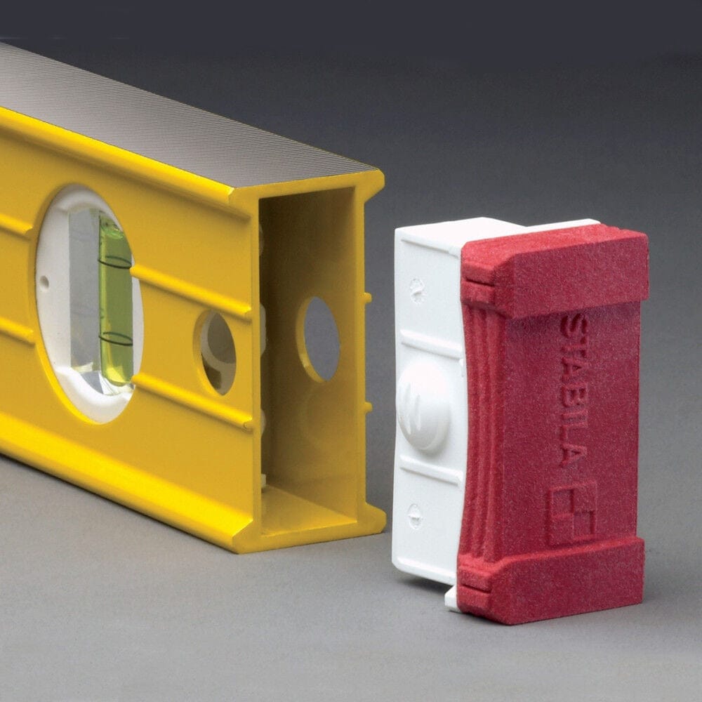 Close-up detail demonstrating the removable end cap feature, showing the red and white cap detached from the hollow yellow aluminum box beam frame.