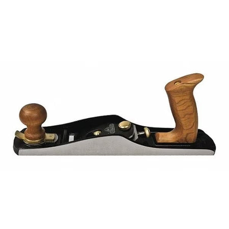 Angled studio view of the Stanley Sweetheart No. 62 low angle jack plane, highlighting the precision-ground silver sides, black iron body, solid cherry wood handles, and brass adjustment hardware.