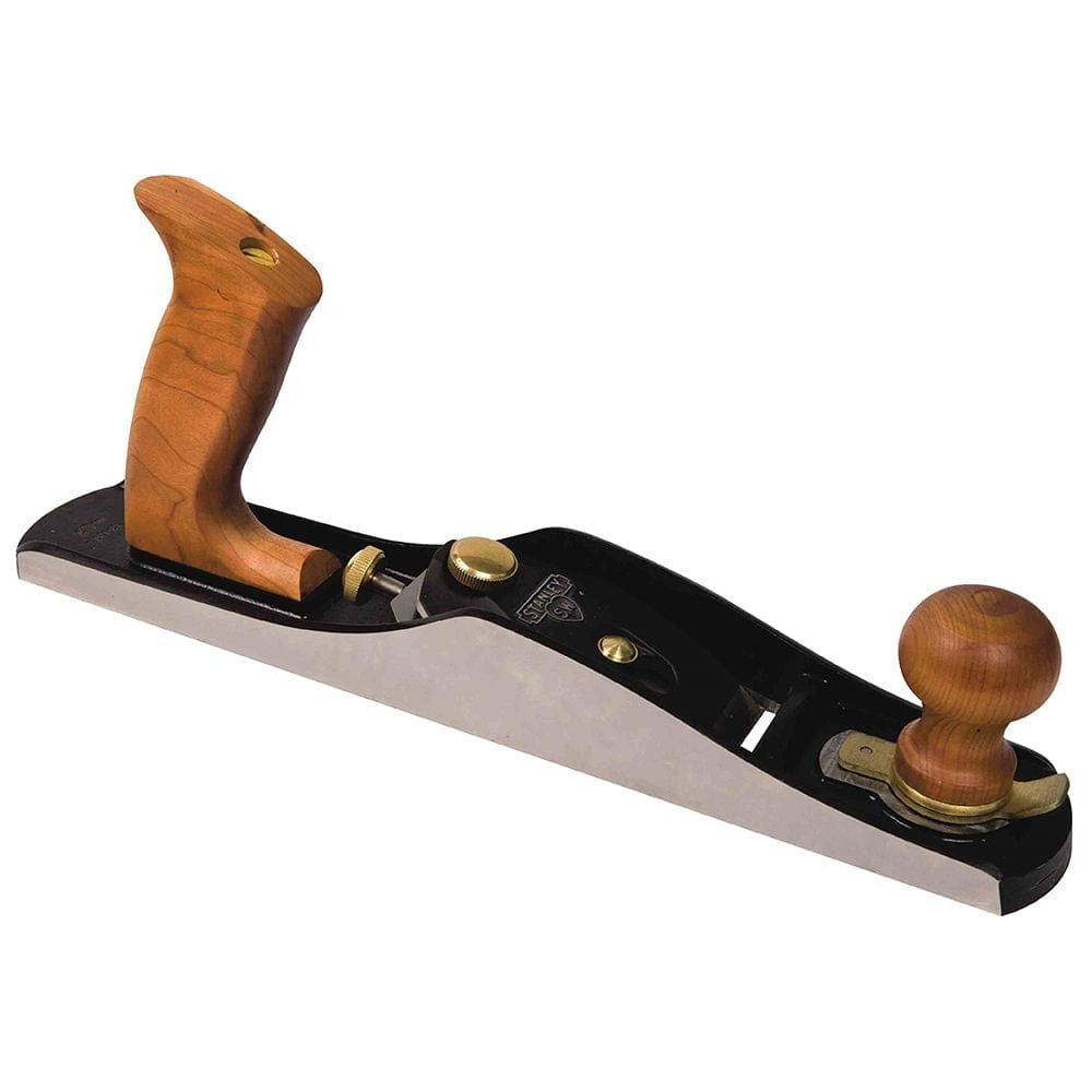 Side profile view of the Stanley low angle jack plane, displaying the long flat sole, the low bedding angle of the iron, and the ergonomic curves of the wooden tote and knob.