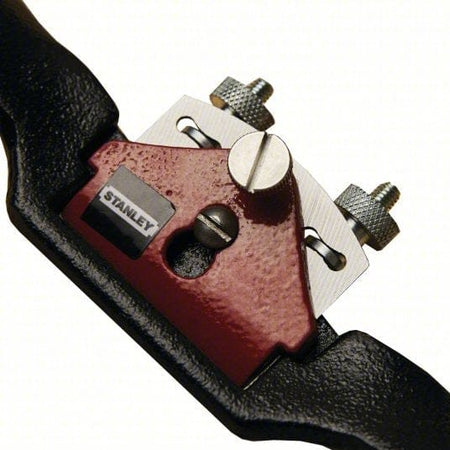 Close-up detail of the central mechanism highlighting the Stanley logo on the red lever cap and the threaded adjustment screws used to control blade depth.