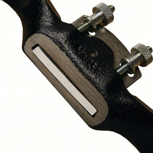 Underside view of the tool revealing the precision ground flat base and the carbon steel cutting edge protruding through the mouth.