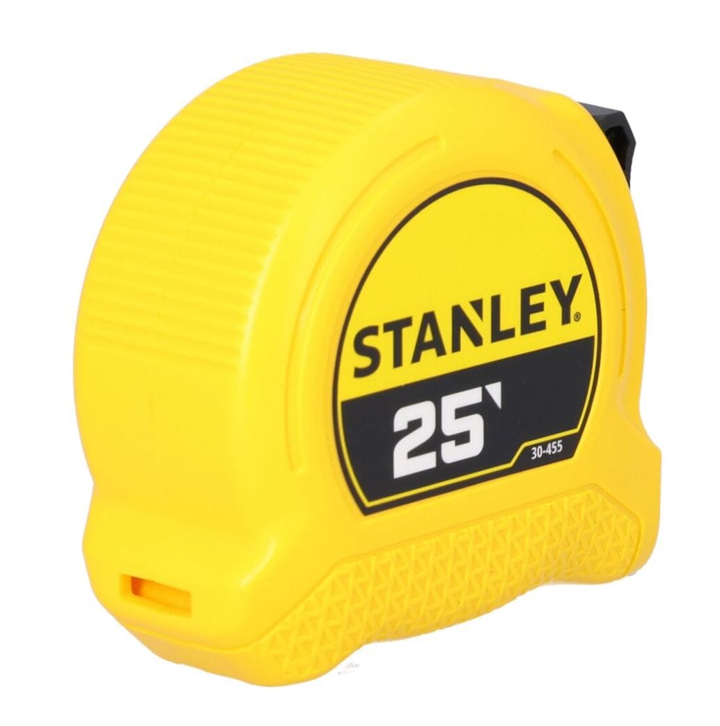 A left-side profile product view of the closed yellow Stanley tape measure case, highlighting the clean structural contours of the molded ABS plastic shell housing.