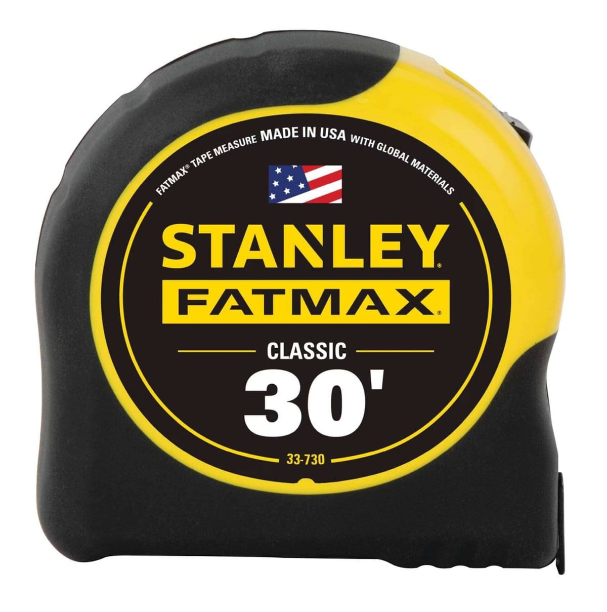 A front-facing view of the Stanley FATMAX 30-foot tape measure case, highlighting the iconic yellow circular label with the model number 33-730, the American flag graphic, and the durable black rubber overmold housing.