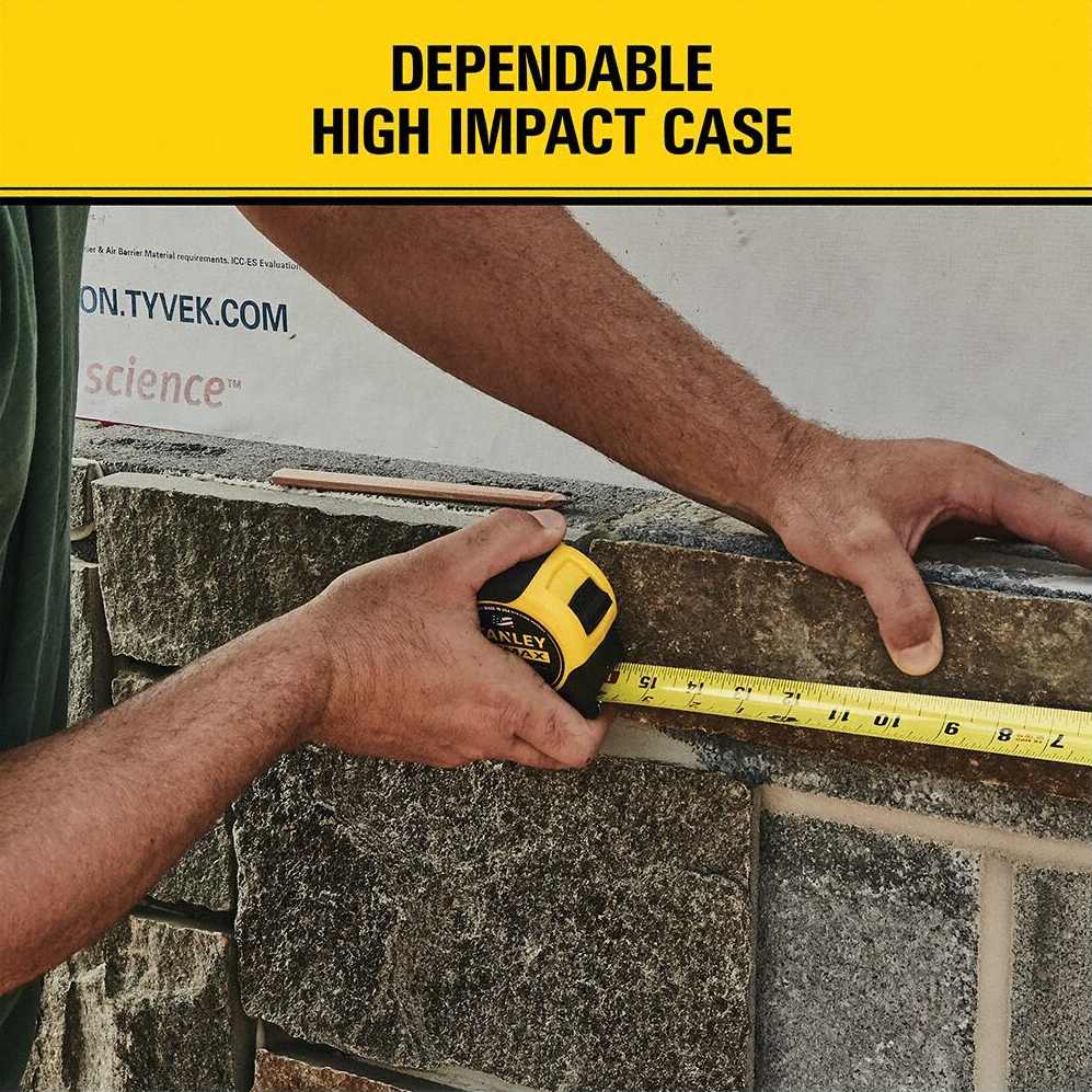 Worker using a Stanley FatMax 16 ft tape measure to measure stonework, demonstrating the tool’s high‑impact case, strong blade standout, and rugged reliability for framing and construction environments.