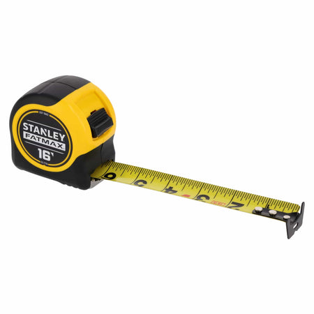 An isometric product perspective shot of the extended Stanley FatMax 16-foot pocket rule, illustrating the high-contrast yellow steel measuring blade with printed fractional markers rolling out through the front slot mouth.