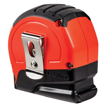 A detailed flat-lay product view of the reverse side of the high-visibility orange Stanley tape rule casing, highlighting the shiny chrome-finished metal belt clip, assembly casing screws, and the stamped technical dimension arrow indicating plus 2-3/4 inches for internal measurements.