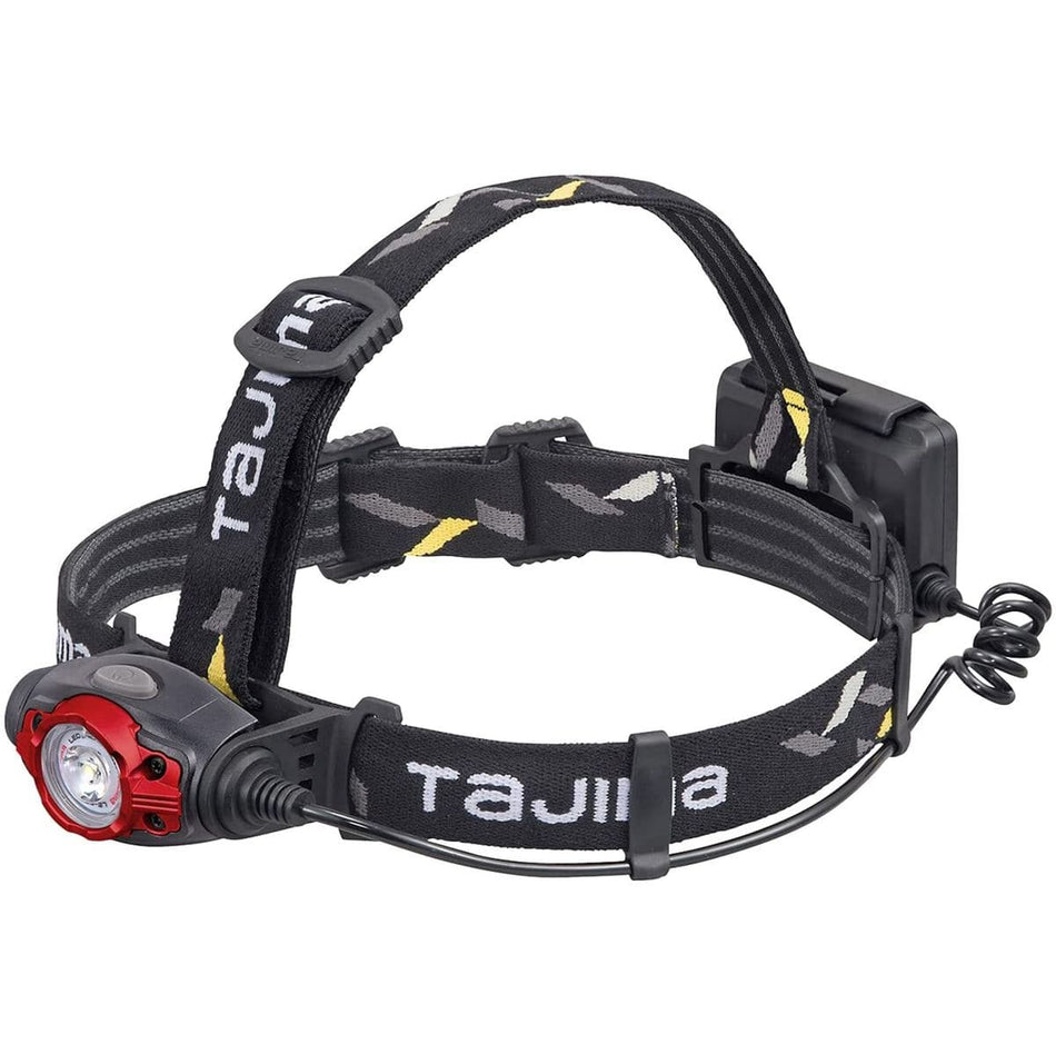 This one looks like a Tajima brand, as the name is visible on the straps. It appears to have an adjustable elastic headband and a light unit with a red accent around the lens.