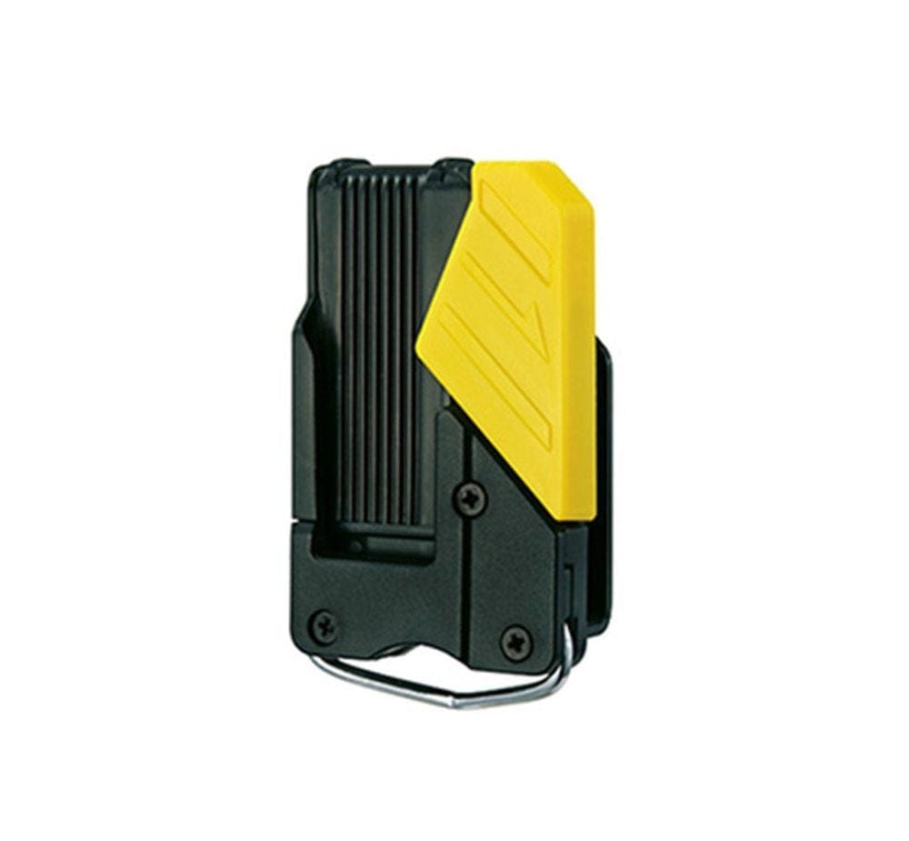 This is the Tajima SF-BHLD Safety Holder for Measuring Tape.

We can clearly see the black and yellow design, the clip mechanism, and the ring at the bottom where the safety rope (AZS-ROP) would attach. This holder is designed to securely keep your Tajima measuring tape accessible on your belt while also providing a point for tethering it, which is a smart safety feature .