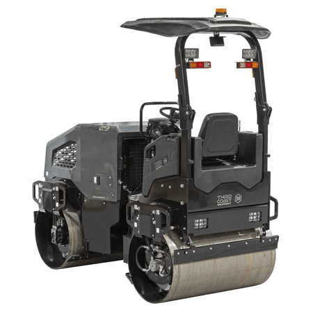 An angled studio view from the rear of the RA29Y compactor emphasizing the dual-drum traction controls and the rugged industrial components built for high-production soil and asphalt compaction.