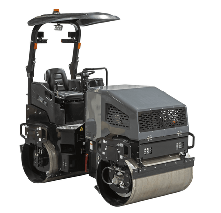 The opposite angled studio shot of the RA29Y vibratory roller showcasing the ergonomic operator station, sliding adjustable seat, and the robust dual-drum drive system designed for 8,540 lbf of compaction force.