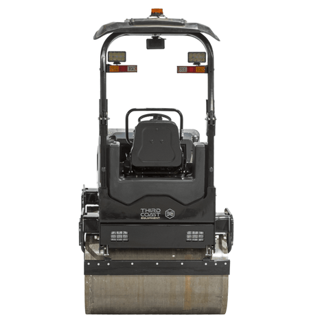 A direct rear view of the Third Coast Equipment RA29Y roller showcasing the folding ROPS safety system, integrated rear LED working lights, and the secondary pressurized water spray bar.