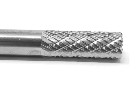 A close-up macro shot of the double-cut (cross-cut) flutes on the head of the UCT Gem Carbide SB1 burr.
