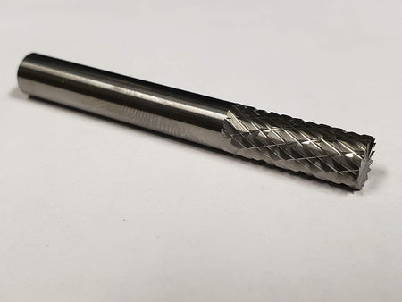 A studio shot of the UCT Gem Carbide SB1 burr lying on a white surface.