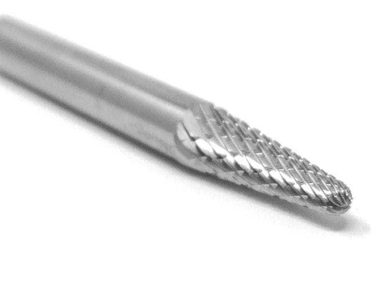 A three-quarter angle studio shot of the UCT Gem Carbide SL-1 burr, highlighting the double-cut, tapered radius-end head.