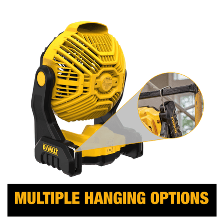 Multiple hanging options. The image shows a yellow and black Dewalt jobsite fan with a round, caged fan head and a sturdy black base. An inset image demonstrates one of its "multiple hanging options" by showing the fan suspended from a horizontal bar using a built-in hook.