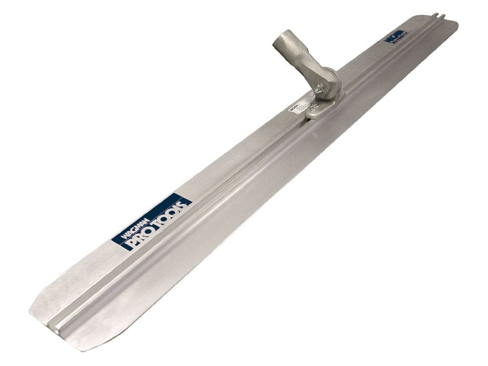 Angled studio view of the aluminum speed float blade featuring rounded ends, a central mounting rib, and an adjustable handle bracket with the Wagman Pro Tools logo.