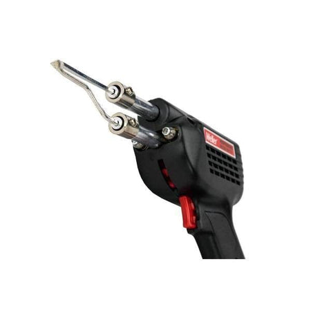 A perspective view of the Weller soldering gun focusing on the heavy-duty copper soldering tip and the dual front-facing LED lights designed to provide superior visibility of the solder joint in dark workspaces.