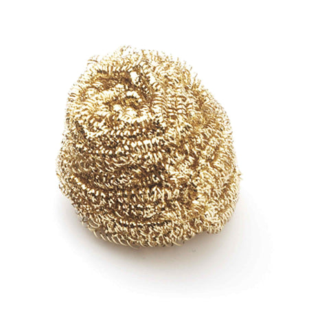 Close-up view of a single Weller non-abrasive brass sponge coil, illustrating the intricate metallic texture used to safely scrub residual solder and oxidation from iron tips without water.