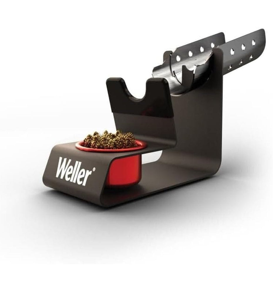 A perspective studio shot of the Weller WLACCH1 heavy-duty metal soldering iron holder featuring an integrated brass dry tip cleaner and a professional black powder-coated finish.