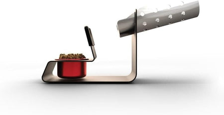 A side-profile technical shot of the Weller WLACCH1 soldering iron holder showcasing the ergonomic elevation and the integrated holder for the brass dry tip cleaning system.