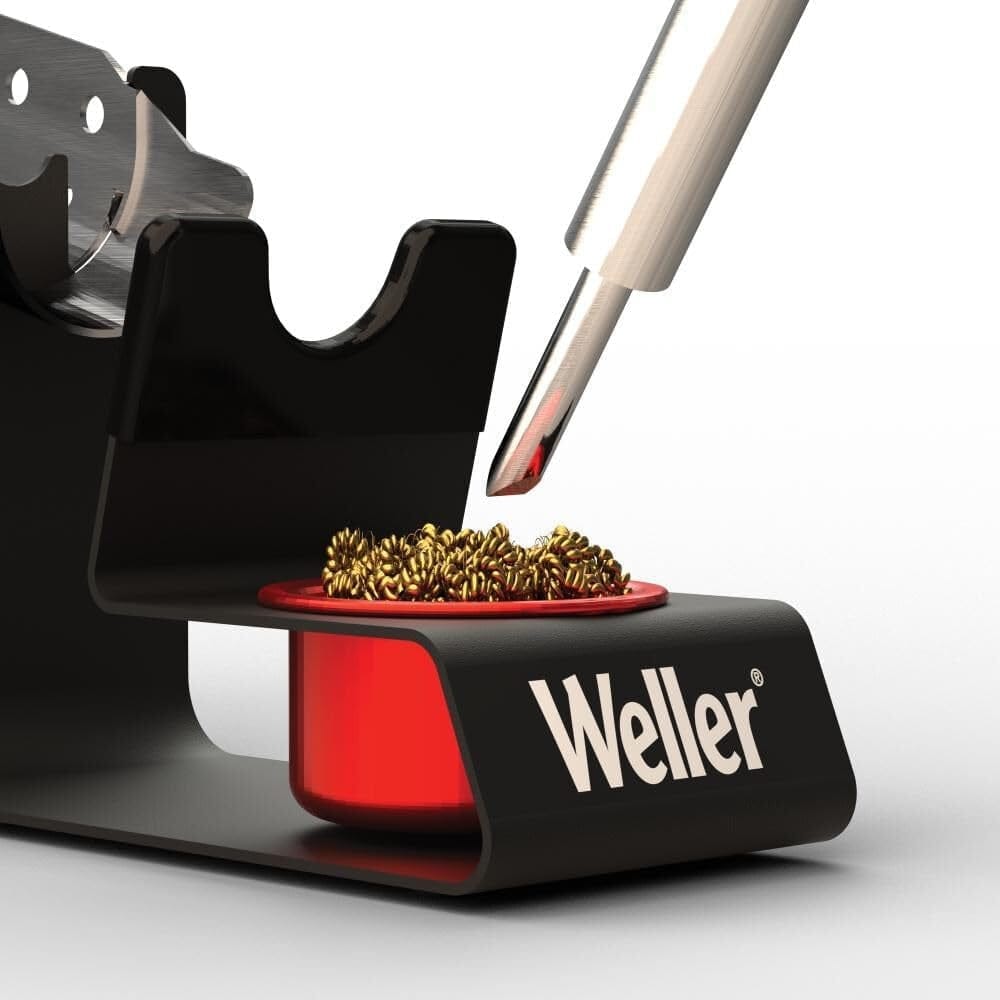 A detailed macro shot of the brass dry tip cleaner inside the Weller WLACCH1 holder, highlighting the specialized wire coils designed to extend soldering iron tip life.