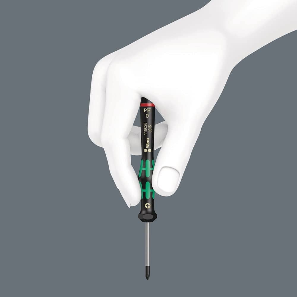 White mannequin hand holding Wera PH0 screwdriver vertically; black handle with green accents and printed model details.