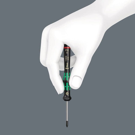 White mannequin hand holding Wera PH0 screwdriver vertically; black handle with green accents and printed model details.
