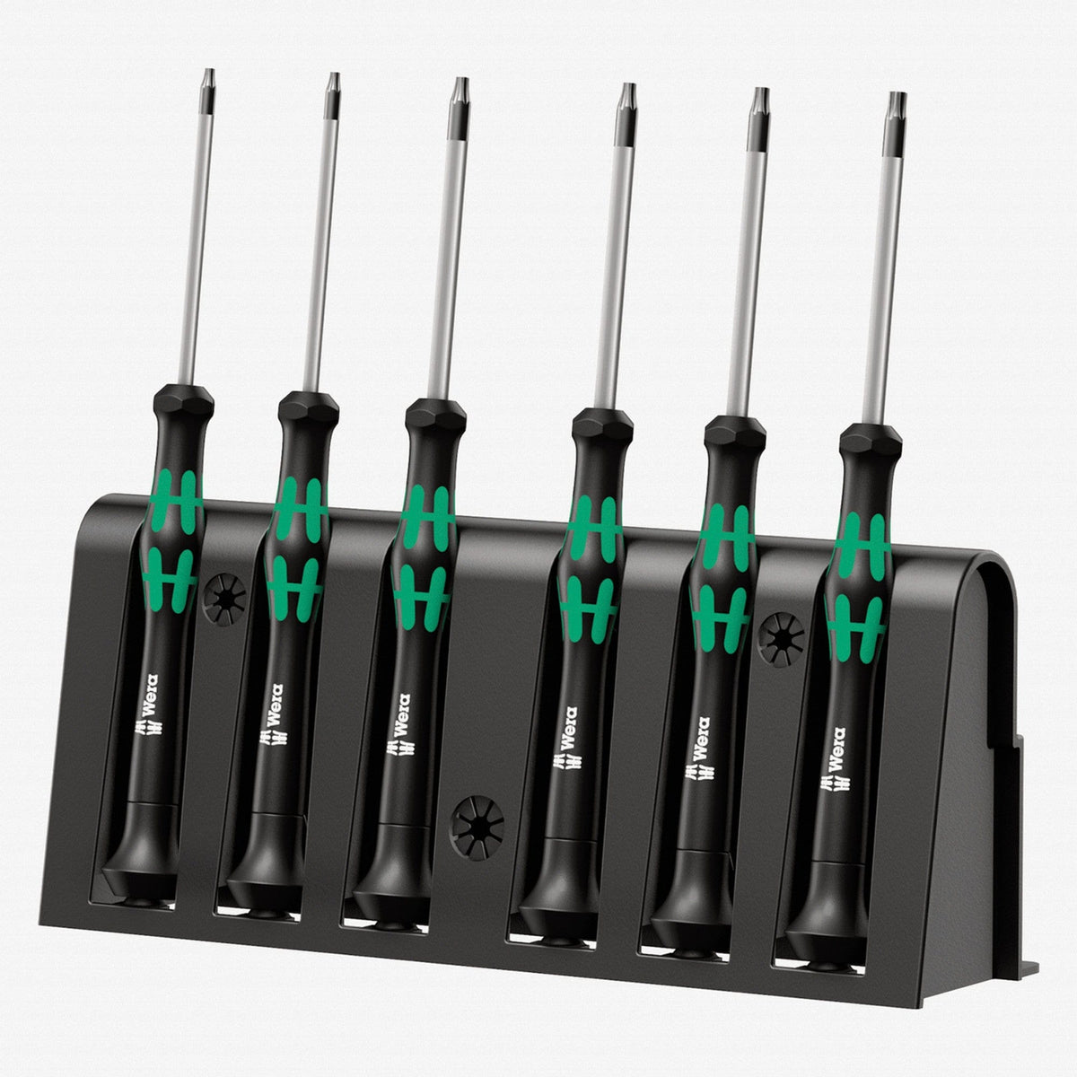 Image of Wera Kraftform Micro Security Torx Precision Screwdriver Set & Rack
The image features a Wera Micro Screwdriver Set. Six screwdrivers with silver shafts and black handles with green ergonomic grips are neatly placed in a black holder. Each handle has a small symbol indicating the screwdriver type. The holder has slots to keep the tools upright and displays the Wera logo. The neutral background emphasizes the organized and high-quality presentation of the micro screwdriver set.

